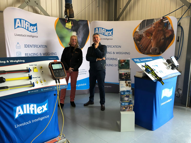 Two curved tension display stands at an event