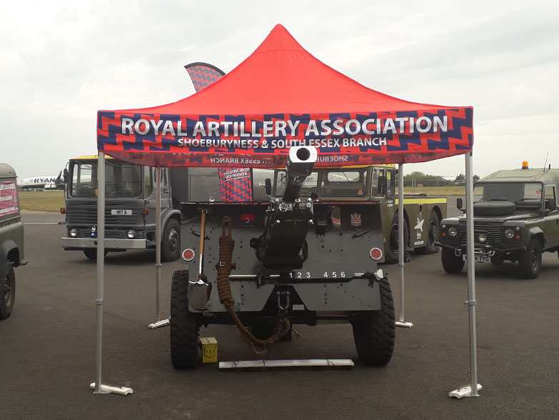 Printed gazebo canopy covering a military vehicle