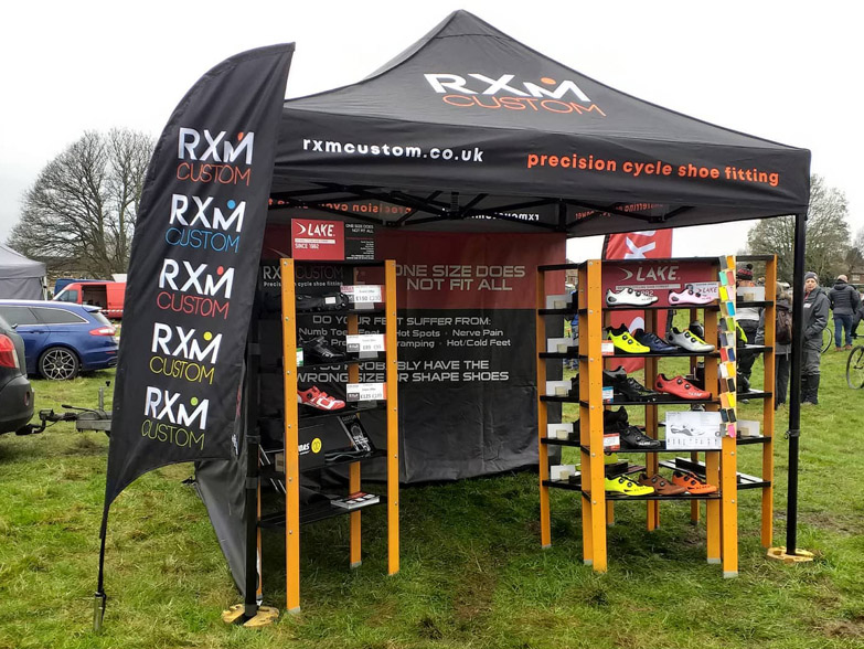 Printed gazebo and flags at an outdoor event