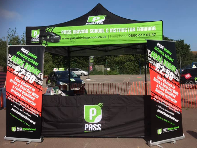 Pass Driving School gazebo at outdoor event