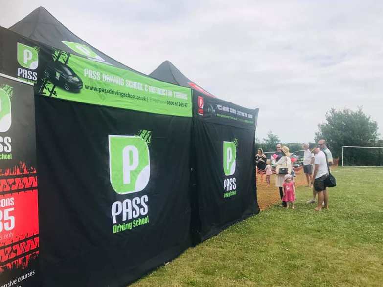 Pass Driving School gazebo rear wall at outdoor event