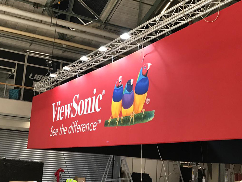 Large printed Hanging Banner being lifted into event space